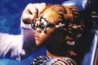Picture of a young girl wearing trial eyeglasses to determine her prescription